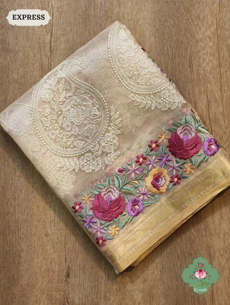 Off White Pure Tissue Silk Saree With Parsi Work & Chikankari Inspired Embroidery On The Border