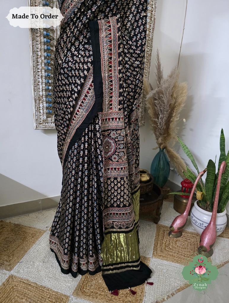 Zynah Made To Order Black Ajrakh Modal Silk Saree With Lagdi Patta Pallu & Hand Embellishments; Custom Stitched/Ready-made Blouse, Fall, Petticoat; SKU:1909202503
