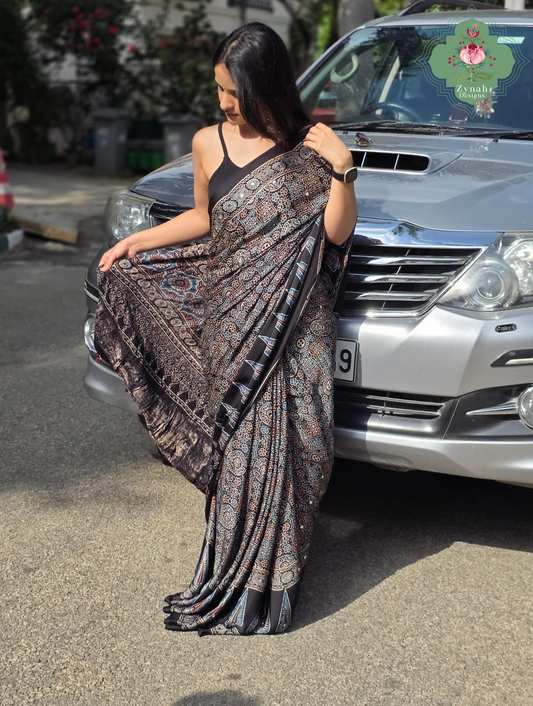 Dilruba Black Modal Silk Ajrakh Saree With Mirror Work And Lagdi Patta Pallu