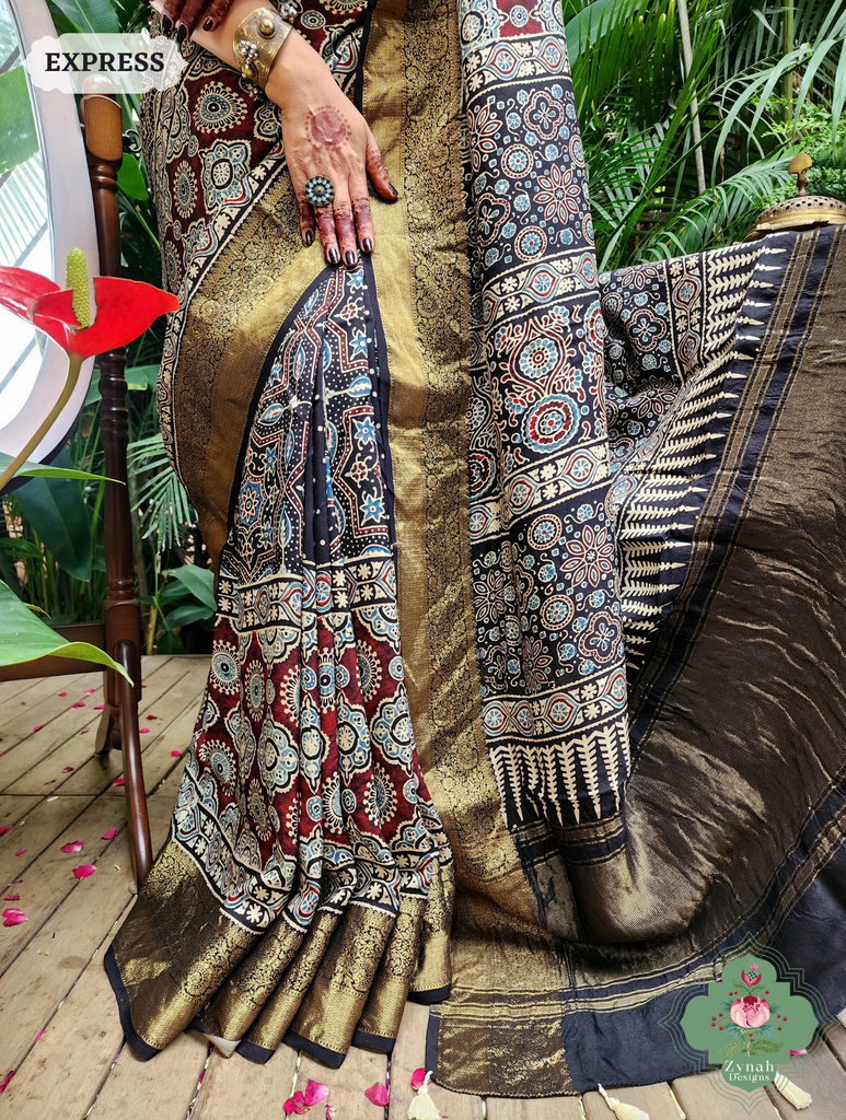 Zynah Black & Maroon Dola Silk Ajrakh Block Printed Saree With Zari Border; Custom Stitched/Ready-made Blouse, Fall, Petticoat; SKU: 1110202402
