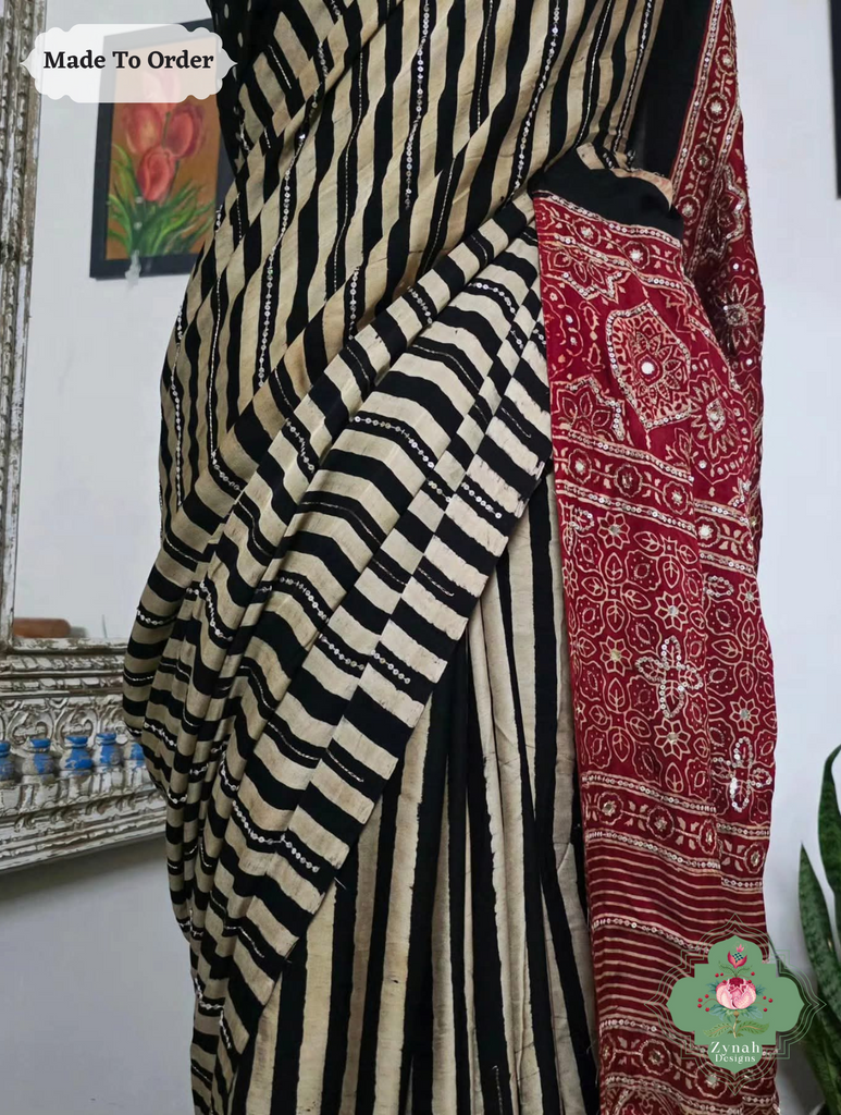 Zynah Made To Order Black & Madder Red Ajrakh Modal Silk Saree With Lagdi Patta Pallu & Hand Embellishments; Custom Stitched/Ready-made Blouse, Fall, Petticoat; SKU:1909202505