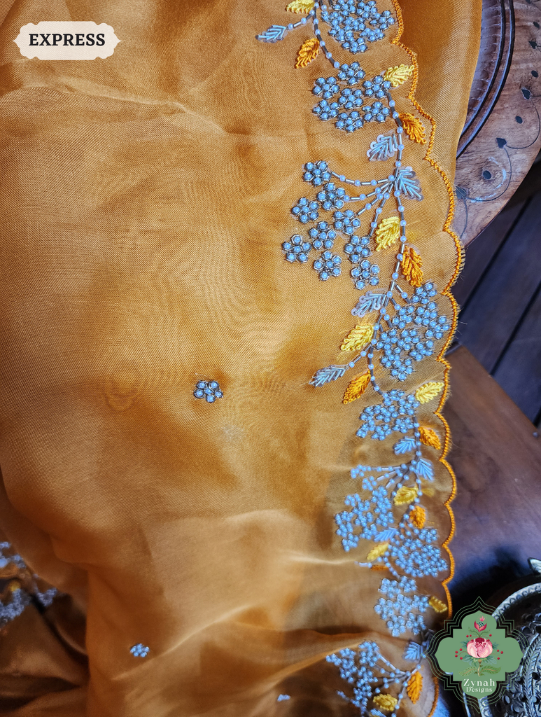 Zynah Burnt Yellow Organza Silk Saree With Pearls & Sequins Hand Embellishments; Custom Stitched/Ready-made Blouse, Fall, Petticoat; SKU: 2711202401