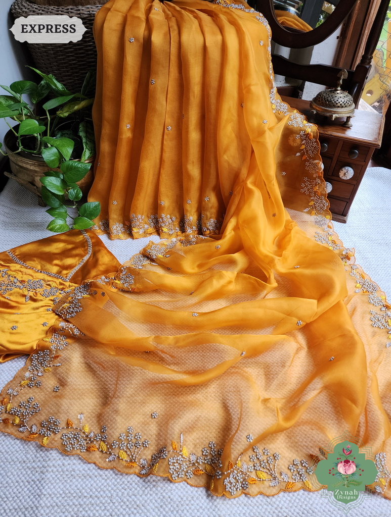 Zynah Burnt Yellow Organza Silk Saree With Pearls & Sequins Hand Embellishments; Custom Stitched/Ready-made Blouse, Fall, Petticoat; SKU: 2711202401