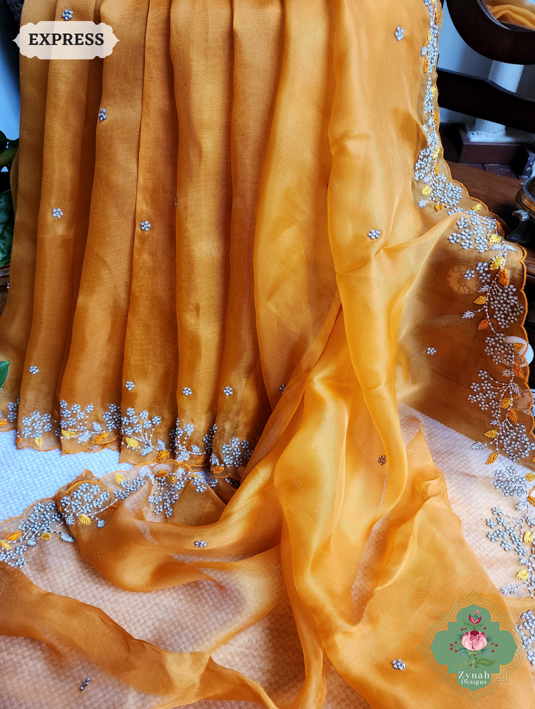 Zynah Burnt Yellow Organza Silk Saree With Pearls & Sequins Hand Embellishments; Custom Stitched/Ready-made Blouse, Fall, Petticoat; SKU: 2711202401