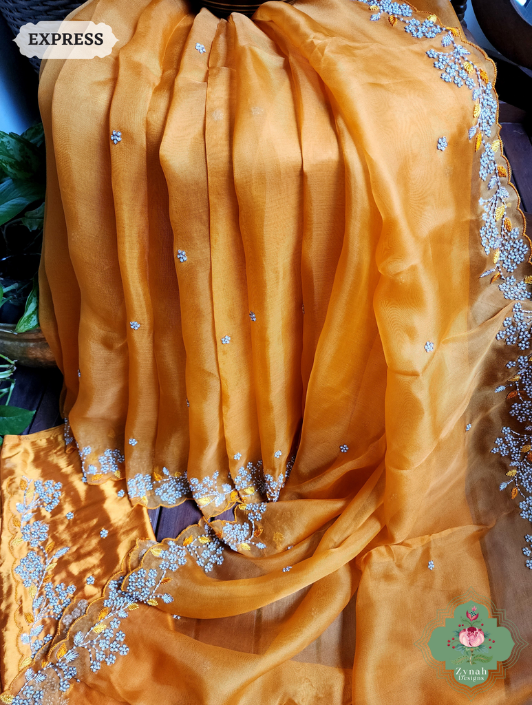 Zynah Burnt Yellow Organza Silk Saree With Pearls & Sequins Hand Embellishments; Custom Stitched/Ready-made Blouse, Fall, Petticoat; SKU: 2711202401