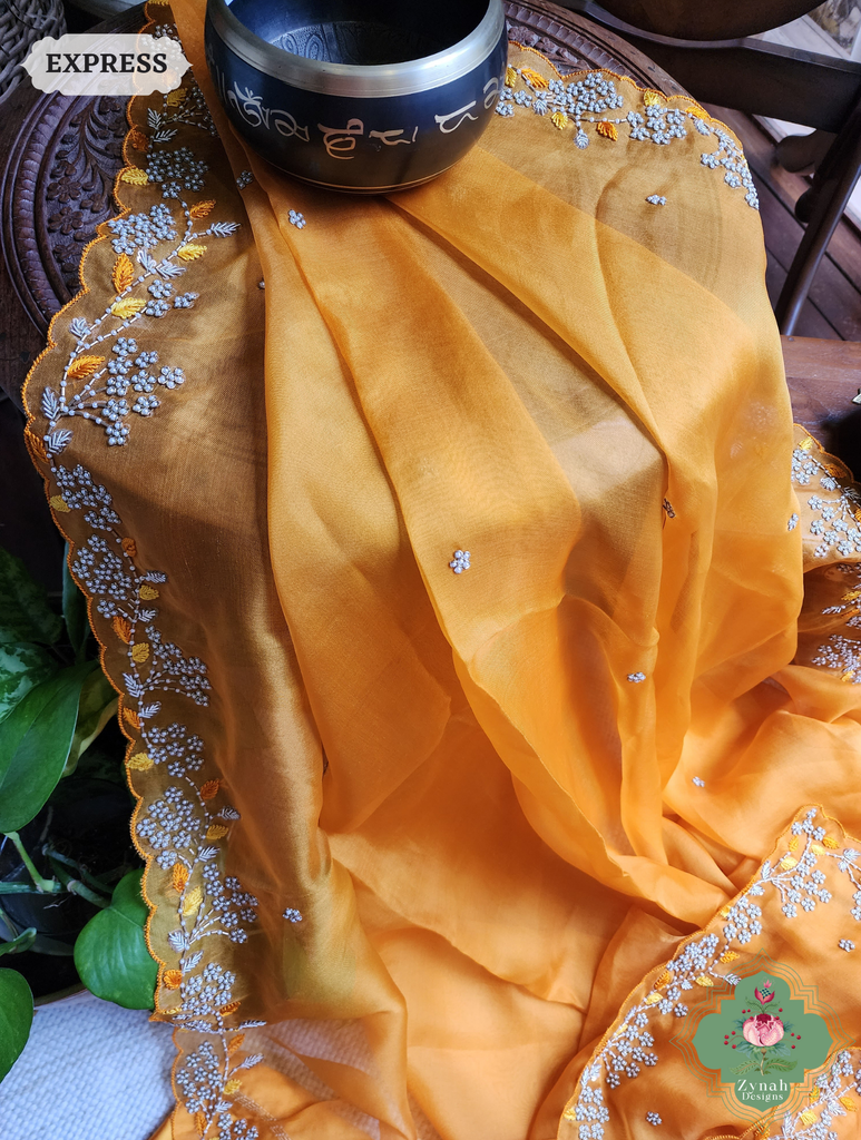 Zynah Burnt Yellow Organza Silk Saree With Pearls & Sequins Hand Embellishments; Custom Stitched/Ready-made Blouse, Fall, Petticoat; SKU: 2711202401
