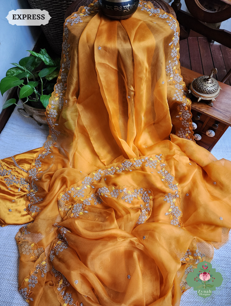 Zynah Burnt Yellow Organza Silk Saree With Pearls & Sequins Hand Embellishments; Custom Stitched/Ready-made Blouse, Fall, Petticoat; SKU: 2711202401