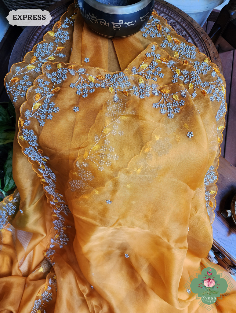 Zynah Burnt Yellow Organza Silk Saree With Pearls & Sequins Hand Embellishments; Custom Stitched/Ready-made Blouse, Fall, Petticoat; SKU: 2711202401