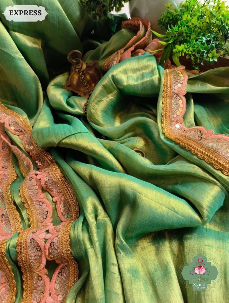 Zynah Metallic Green Linen Tissue Saree With Scalloped Lace & Orange Tassels; Custom Stitched/Ready-made Blouse, Fall, Petticoat; SKU: 2703202509