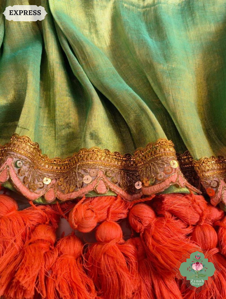 Zynah Metallic Green Linen Tissue Saree With Scalloped Lace & Orange Tassels; Custom Stitched/Ready-made Blouse, Fall, Petticoat; SKU: 2703202509
