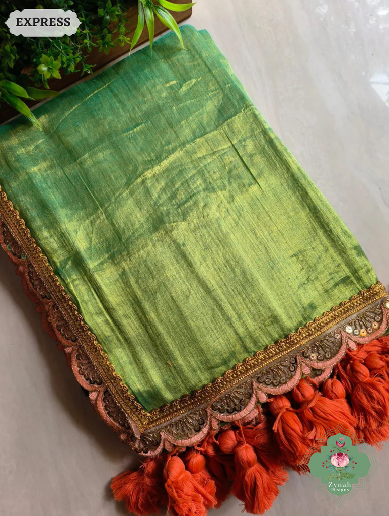 Zynah Metallic Green Linen Tissue Saree With Scalloped Lace & Orange Tassels; Custom Stitched/Ready-made Blouse, Fall, Petticoat; SKU: 2703202509