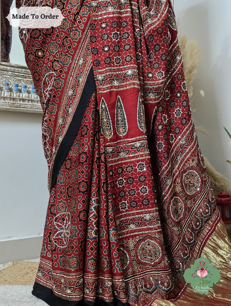Zynah Made To Order Madder Red Ajrakh Modal Silk Saree With Lagdi Patta Pallu & Hand Embellishments; Custom Stitched/Ready-made Blouse, Fall, Petticoat; SKU:1909202510