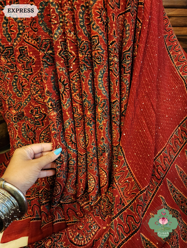 Zynah Madder Red Hand-Block Printed Georgette Silk Ajrakh Saree with Sequins Highlight; Custom Stitched/Ready-made Blouse, Fall, Petticoat; SKU: 1004202508