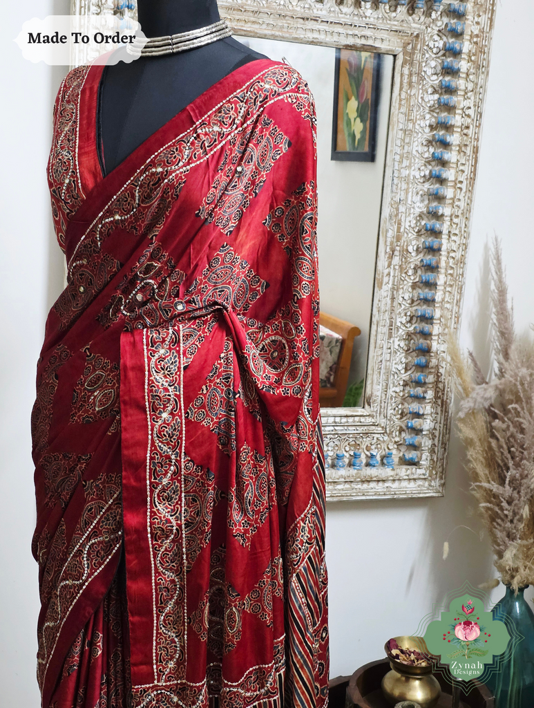 Zynah Made To Order Madder Red Ajrakh Modal Silk Saree With Hand Embellishments; Custom Stitched/Ready-made Blouse, Fall, Petticoat; SKU:1909202511