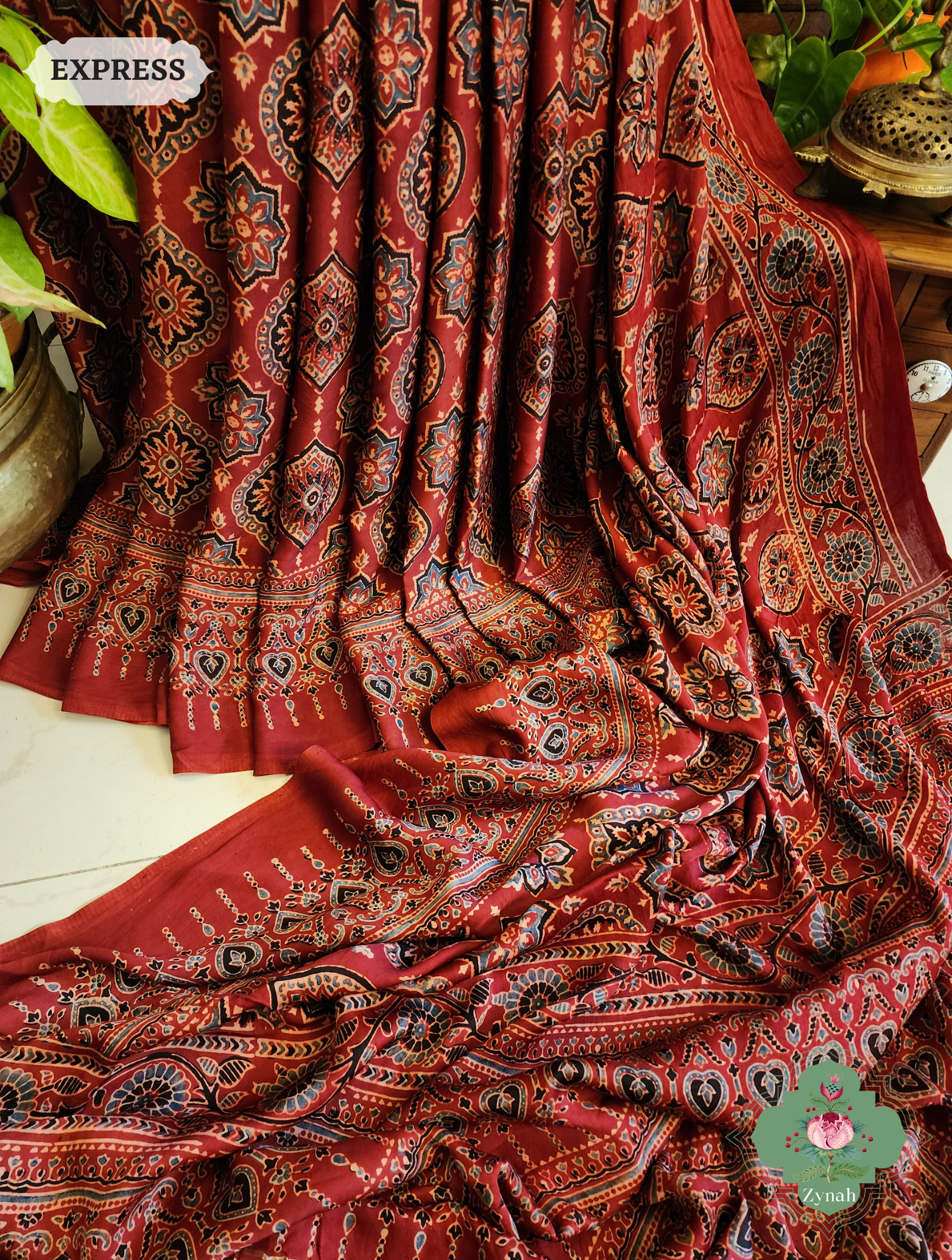 Zynah Madder Red Modal Silk Ajrakh Saree With Zari Lagdi  Patta on Pallu; Custom Stitched/Ready-made Blouse, Fall, Petticoat; SKU: 0809202302 Zynah Madder Red Modal Silk Ajrakh Saree With Zari Lagdi  Patta on Pallu; Custom Stitched/Ready-made Blouse, Fall, Petticoat; SKU: 0809202302