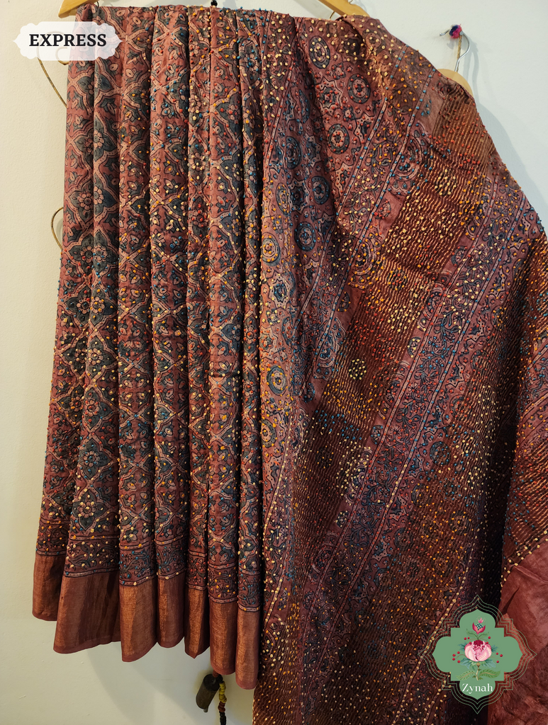 Zynah Madder Red Ajrakh Pure Tussar Silk Saree, Traditional Method Of Hand Block Printing Using 100% Natural Dyes, Hand Embroidery Highlighting The Motifs; Custom Stitched/Ready-made Blouse, Fall, Petticoat; SKU: 1710202301