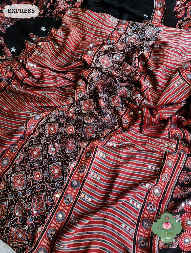 Zynah Madder Red & Black Ajrakh Modal Silk Saree With Sequins Highlight Crafted Using The Traditional Method Of Hand Block Printing Using 100% Natural Dyes; Custom Stitched/Ready-made Blouse, Fall, Petticoat; SKU: 1402202506