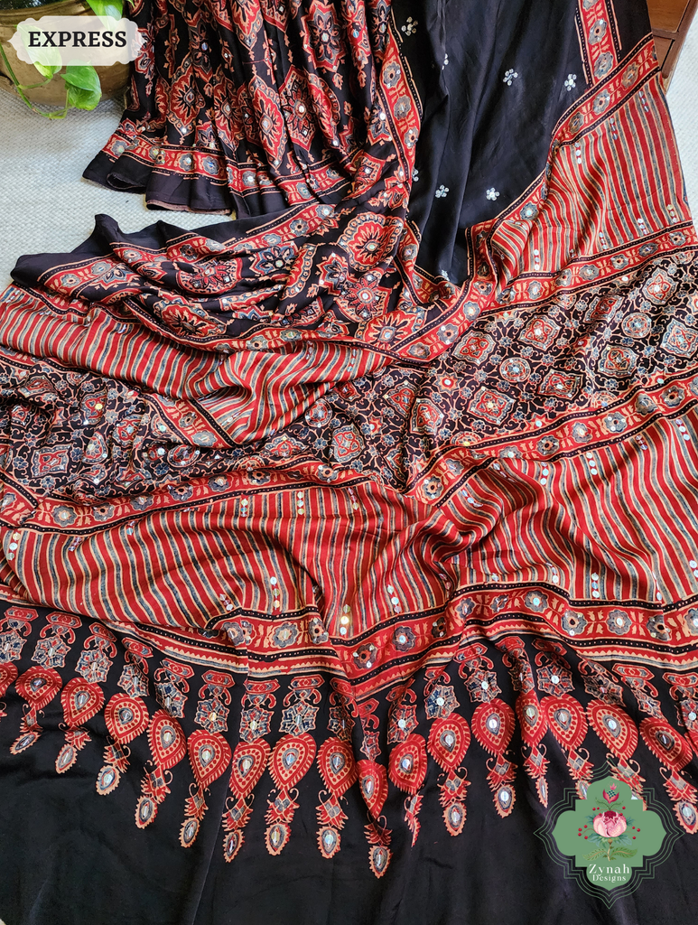 Zynah Madder Red & Black Ajrakh Modal Silk Saree With Sequins Highlight Crafted Using The Traditional Method Of Hand Block Printing Using 100% Natural Dyes; Custom Stitched/Ready-made Blouse, Fall, Petticoat; SKU: 1402202506