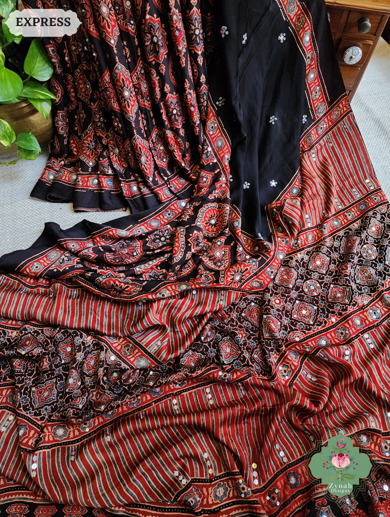 Zynah Madder Red & Black Ajrakh Modal Silk Saree With Sequins Highlight Crafted Using The Traditional Method Of Hand Block Printing Using 100% Natural Dyes; Custom Stitched/Ready-made Blouse, Fall, Petticoat; SKU: 1402202506