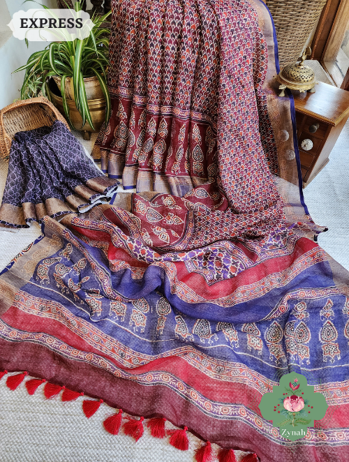 Maroon Linen Saree w/ Ajrakh Print: ethnic charm meets contemporary style. High-quality linen, intricate print in maroon,