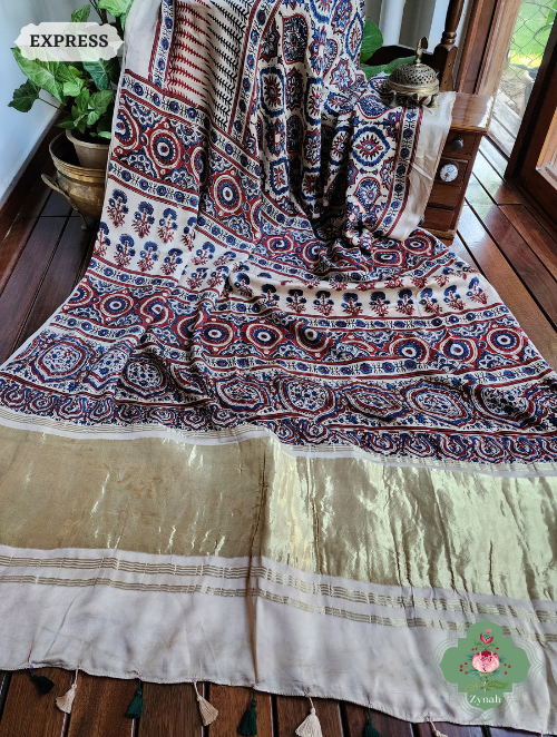 Off White Ajrakh Modal Silk Saree With Lagdi Patta On Pallu, Crafted Using The Traditional Method Of Hand Block Printing Using 100% Natural Dyes