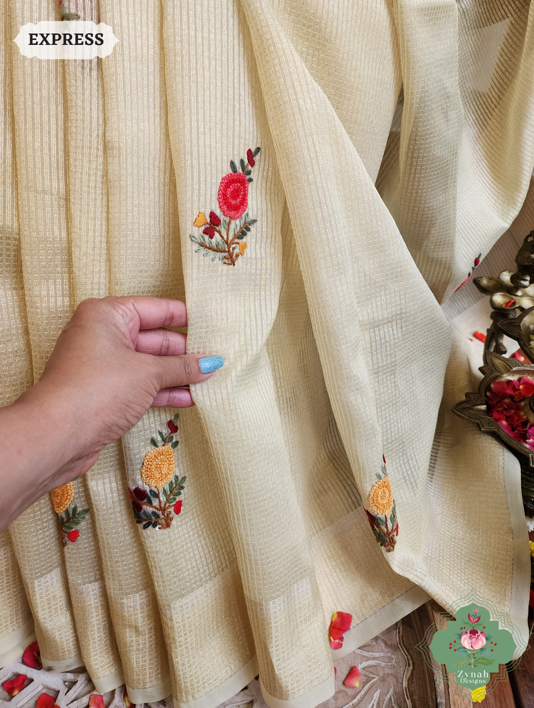 Zynah Off White Kota Tissue Saree With Golden Check, Jamdani Weaving Organza Pallu & Frenchknot Hand Embroidery; Custom Stitched/Ready-made Blouse, Fall, Petticoat; SKU: 1209202401