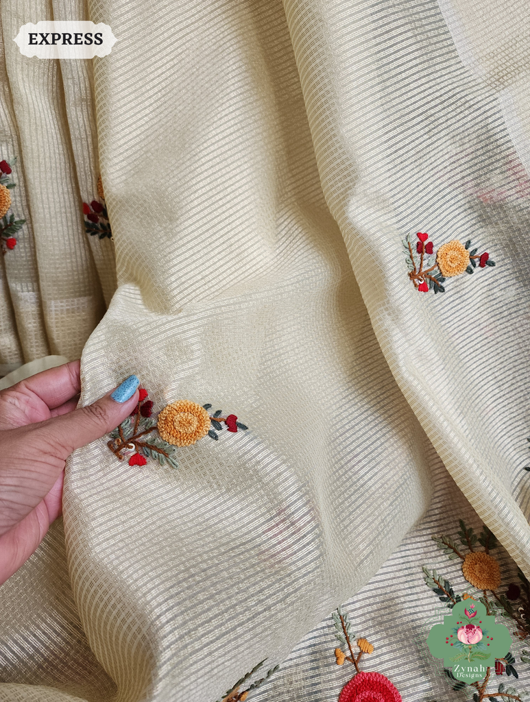 Zynah Off White Kota Tissue Saree With Golden Check, Jamdani Weaving Organza Pallu & Frenchknot Hand Embroidery; Custom Stitched/Ready-made Blouse, Fall, Petticoat; SKU: 1209202401