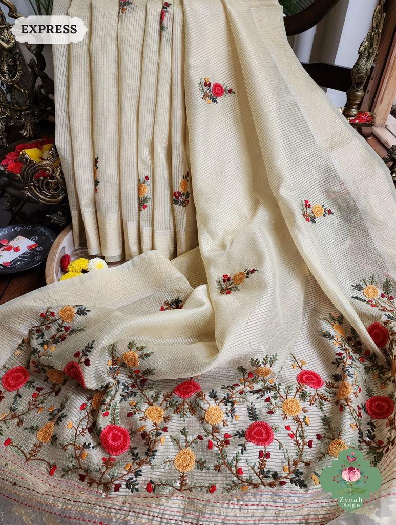 Zynah Off White Kota Tissue Saree With Golden Check, Jamdani Weaving Organza Pallu & Frenchknot Hand Embroidery; Custom Stitched/Ready-made Blouse, Fall, Petticoat; SKU: 1209202401
