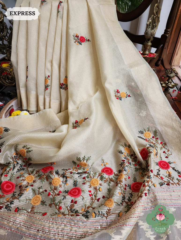 Zynah Off White Kota Tissue Saree With Golden Check, Jamdani Weaving Organza Pallu & Frenchknot Hand Embroidery; Custom Stitched/Ready-made Blouse, Fall, Petticoat; SKU: 1209202401
