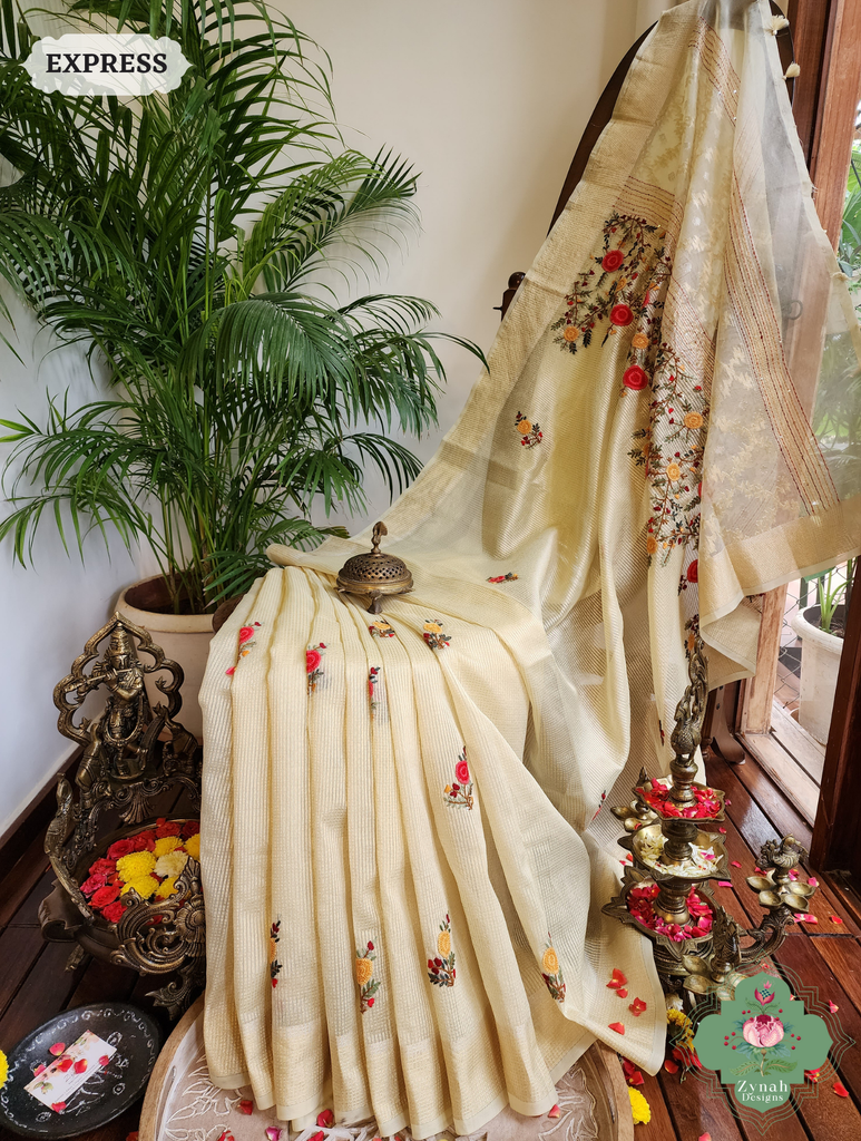 Zynah Off White Kota Tissue Saree With Golden Check, Jamdani Weaving Organza Pallu & Frenchknot Hand Embroidery; Custom Stitched/Ready-made Blouse, Fall, Petticoat; SKU: 1209202401