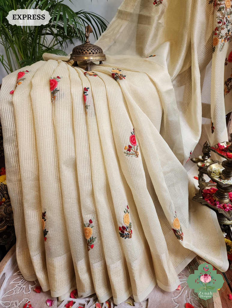 Zynah Off White Kota Tissue Saree With Golden Check, Jamdani Weaving Organza Pallu & Frenchknot Hand Embroidery; Custom Stitched/Ready-made Blouse, Fall, Petticoat; SKU: 1209202401