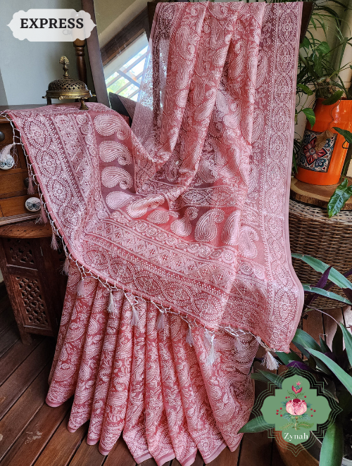 Dusty Peach Organza Chikankari Saree: Handcrafted elegance with traditional embroidery and delicate paisley motifs.