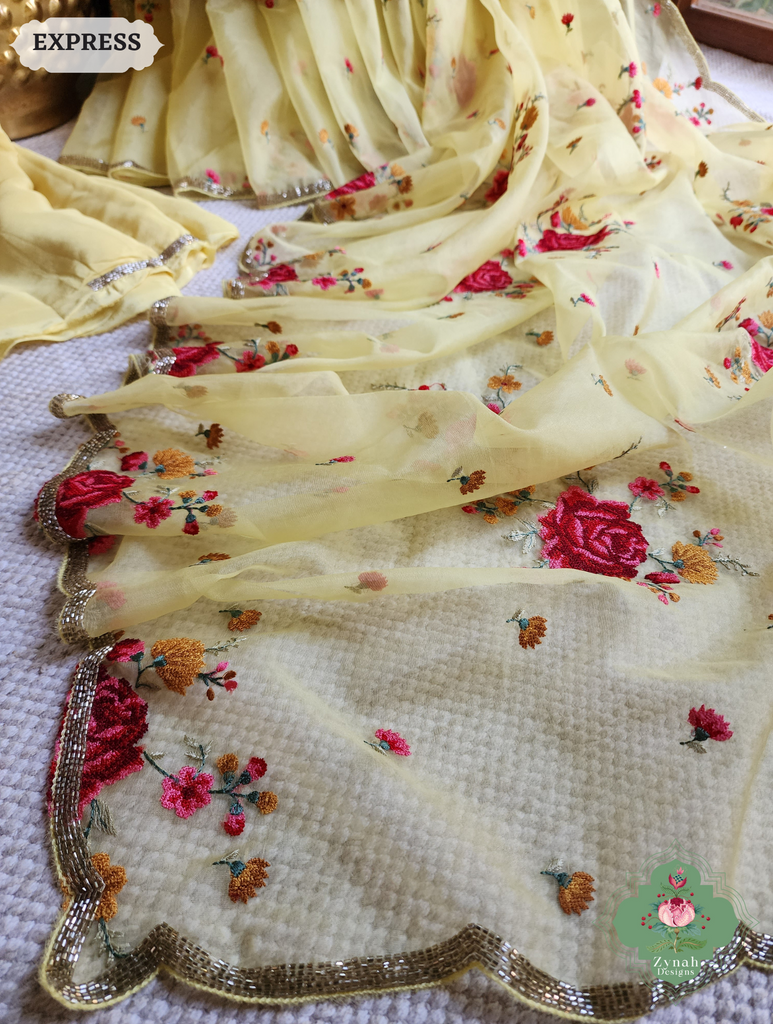 Zynah Yellow Organza Silk Saree Featuring Cross-Stitch Embroidered Roses & Scalloped Border Hand Embellished With Cutdana; Custom Stitched/Ready-made Blouse, Fall, Petticoat; SKU: 1112202401
