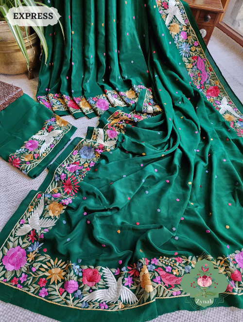 Green Pure Crepe Silk Saree with Hand-Embroidered Parsi Gara work in floral motifs. Traditional and elegant.