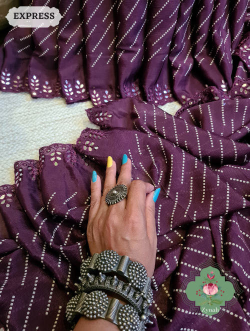 Zynah Wine Wrinkle Crepe Silk Saree with Bandhani Inspired Prints & Mirror Work Scalloped Borders; Custom Stitched/Ready-made Blouse, Fall, Petticoat; SKU: 0202202304 Zynah Wine Wrinkle Crepe Silk Saree with Bandhani Inspired Prints & Mirror Work Scalloped Borders; Custom Stitched/Ready-made Blouse, Fall, Petticoat; SKU: 0202202304