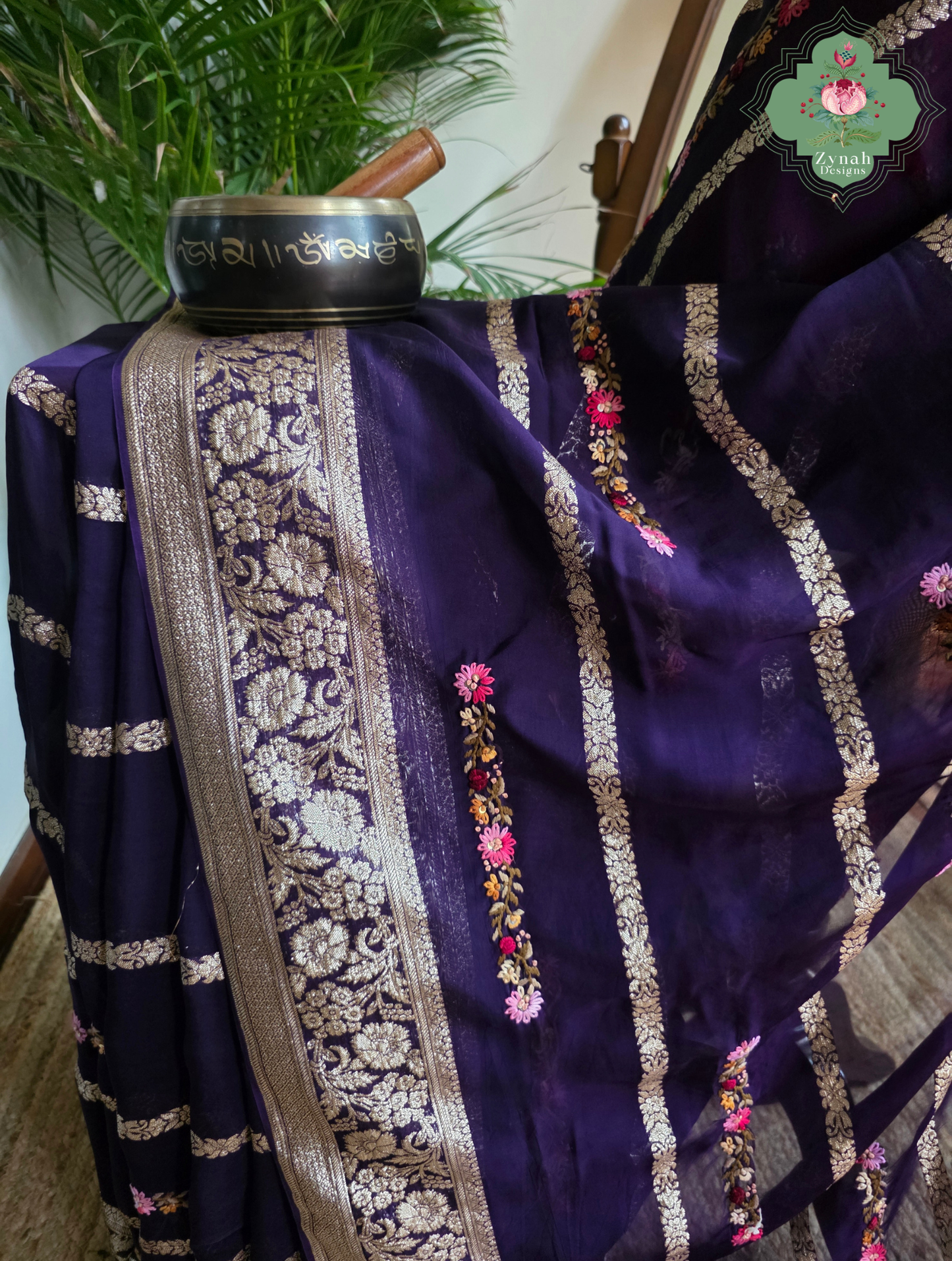 Zynah Aubergine Rêverie – Aubergine Organza Crepe Silk Saree with Zari Borders, Stripes & French Knot Hand Embroidery