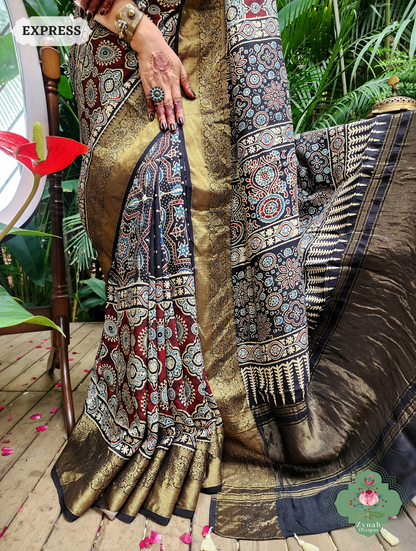 Zynah Black & Maroon Dola Silk Ajrakh Block Printed Saree With Zari Border; Custom Stitched/Ready-made Blouse, Fall, Petticoat; SKU: 1110202402