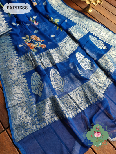 Blue Khaddi Georgette Floral Banarasi Saree w/ Silver Zari. Traditional elegance meets modern style. Perfect for any occasion.