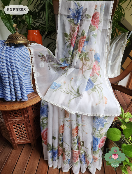 Gorgeous off-white organza silk saree with bold floral prints and kantha accents. Perfect for special occasions.