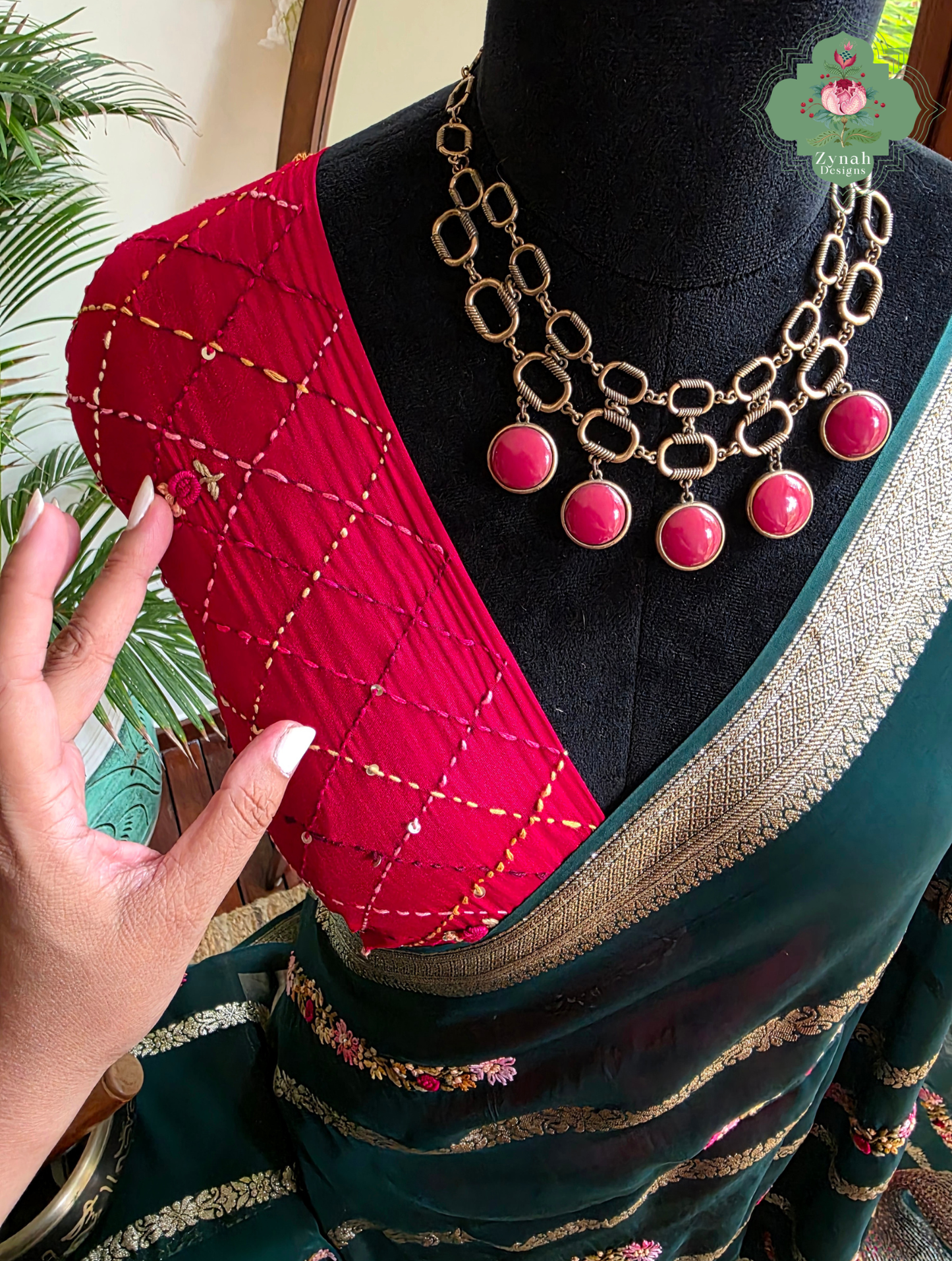 Zynah Émeraude Rêverie – Bottle Green Organza Crepe Silk Saree with Gold Zari Borders, Stripes & French Knot Hand Embroidery
