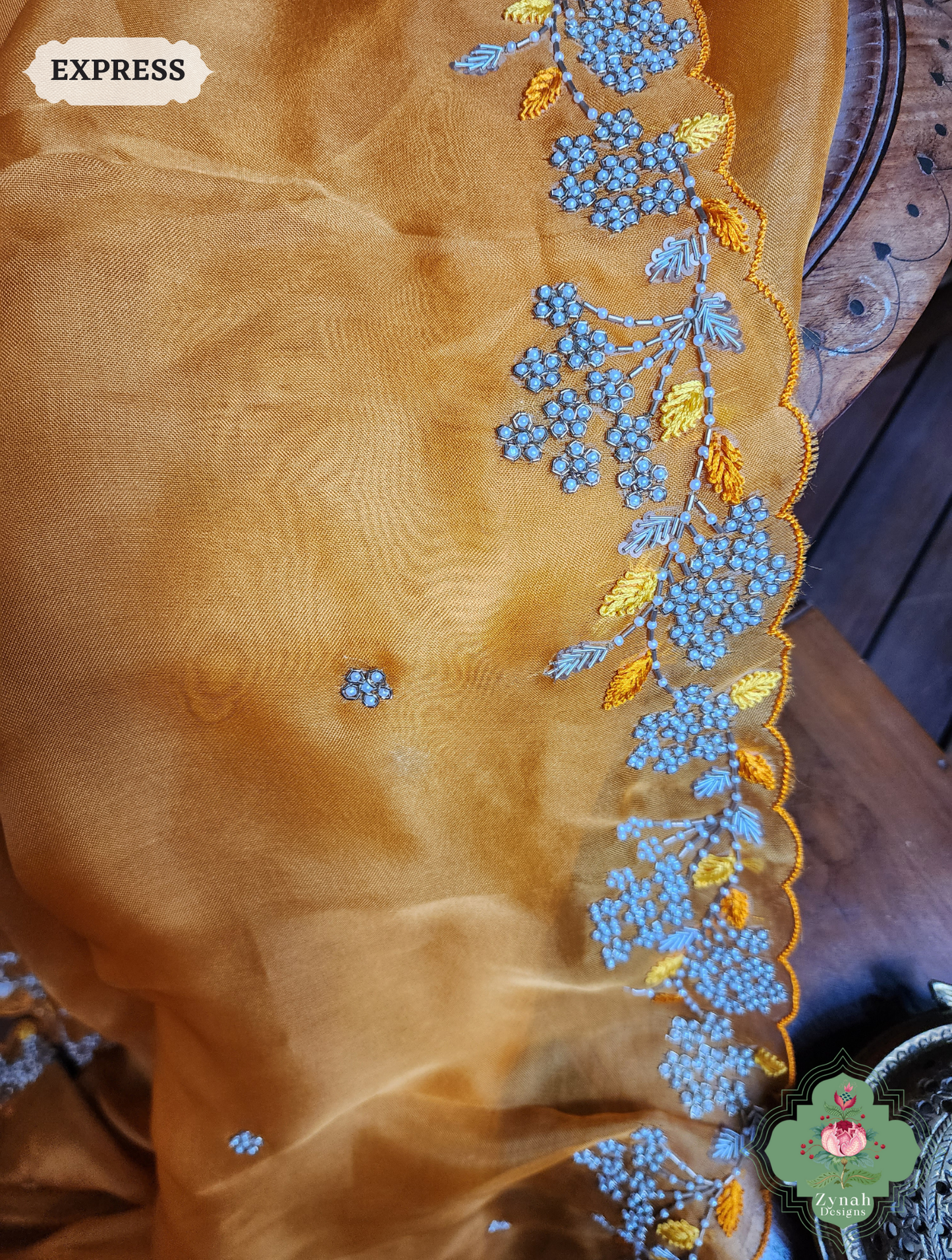 Zynah Burnt Yellow Organza Silk Saree With Pearls & Sequins Hand Embellishments; Custom Stitched/Ready-made Blouse, Fall, Petticoat; SKU: 2711202401