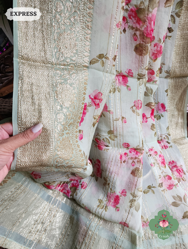 Zynah Pista Green Organza Satin Silk Saree With Zari Border & Zari Stripes & English Garden Print Print; Custom Stitched/Ready-made Blouse, Fall, Petticoat; SKU: 2306202303