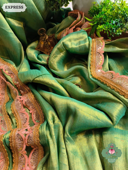 Zynah Metallic Green Linen Tissue Saree With Scalloped Lace & Orange Tassels; Custom Stitched/Ready-made Blouse, Fall, Petticoat; SKU: 2703202509