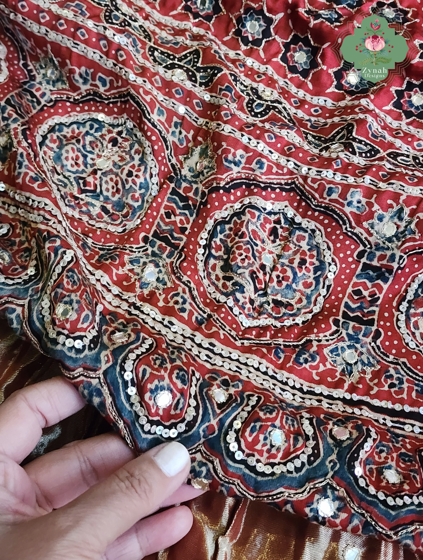 Zynah Kirmizi – Madder Red Pure Modal Silk Ajrakh Saree with Ajrakh Hand Block Printing & Artisan Adornments