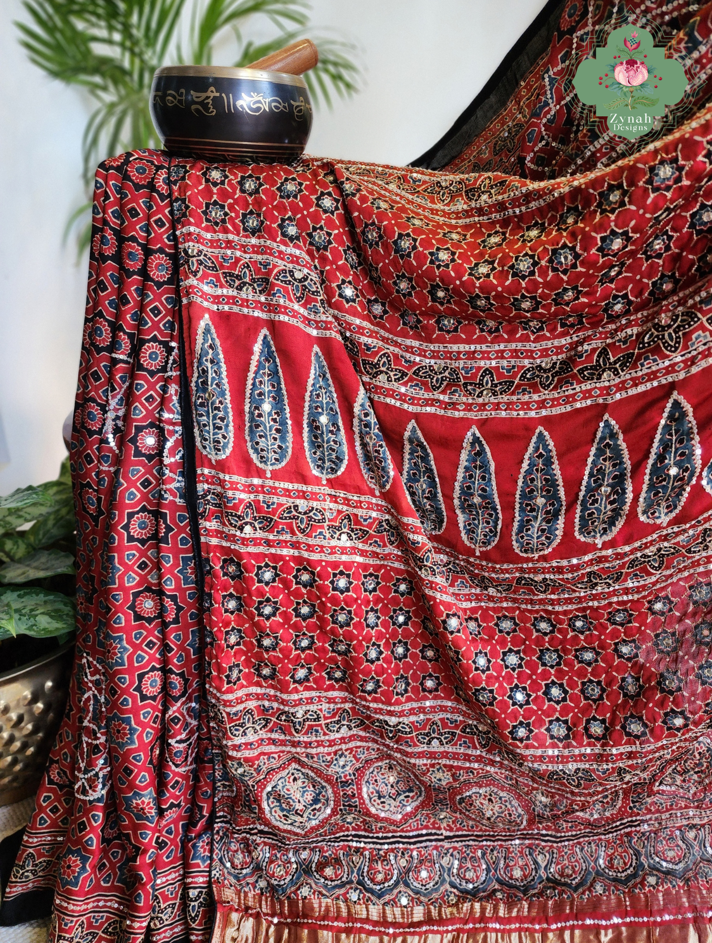 Zynah Kirmizi – Madder Red Pure Modal Silk Ajrakh Saree with Ajrakh Hand Block Printing & Artisan Adornments