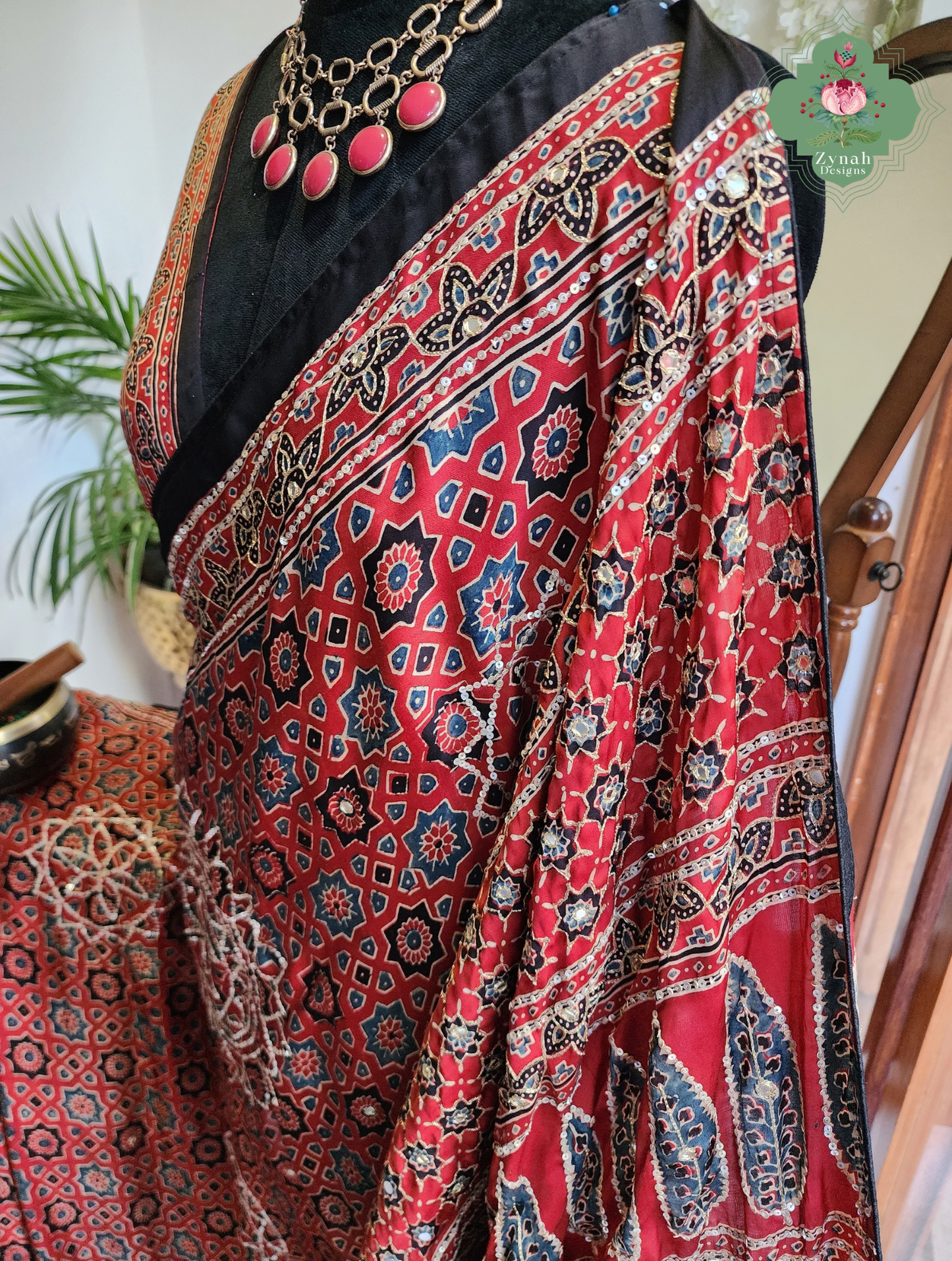 Zynah Kirmizi – Madder Red Pure Modal Silk Ajrakh Saree with Ajrakh Hand Block Printing & Artisan Adornments