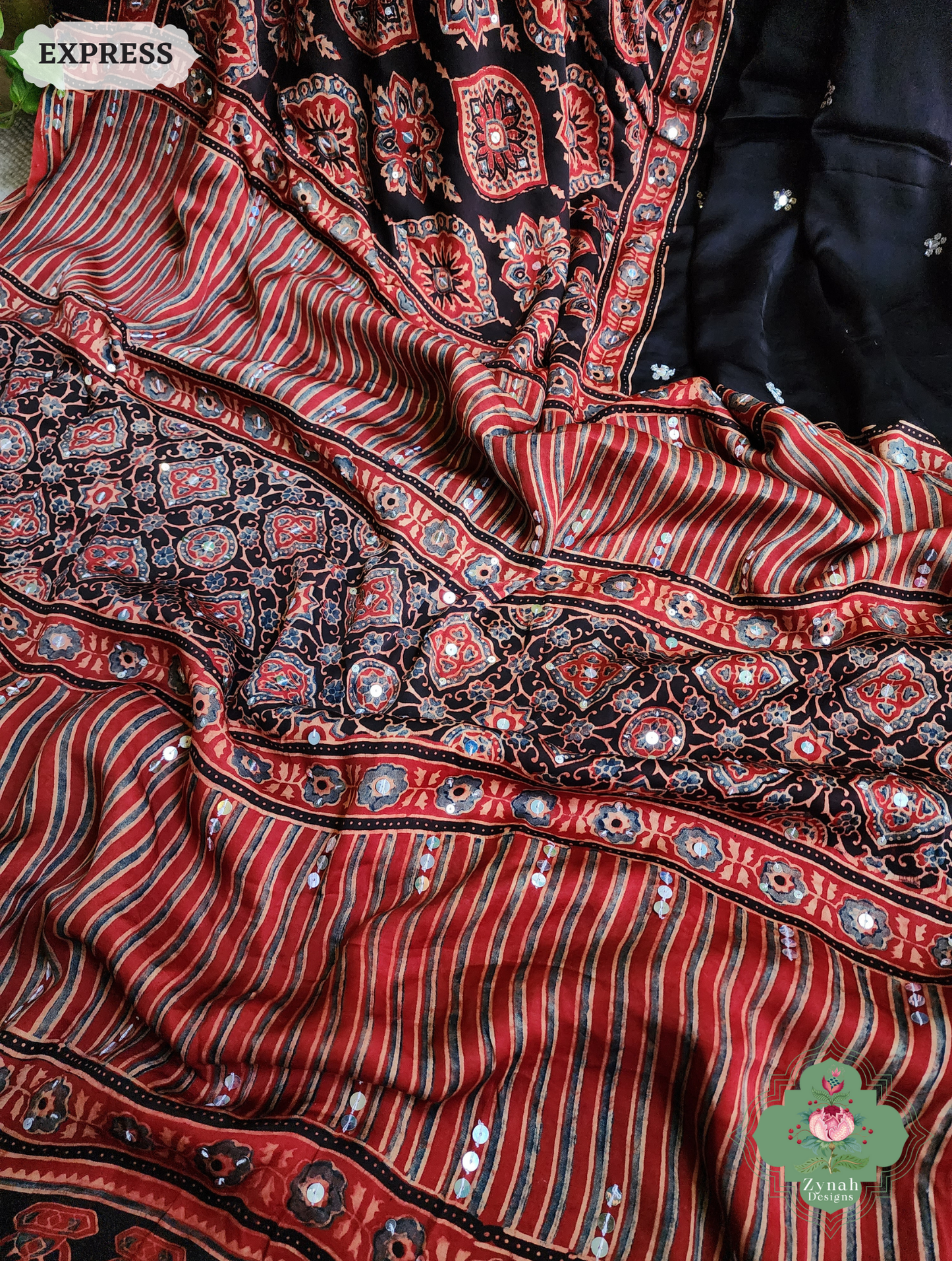 Zynah Madder Red & Black Ajrakh Modal Silk Saree With Sequins Highlight Crafted Using The Traditional Method Of Hand Block Printing Using 100% Natural Dyes; Custom Stitched/Ready-made Blouse, Fall, Petticoat; SKU: 1402202506