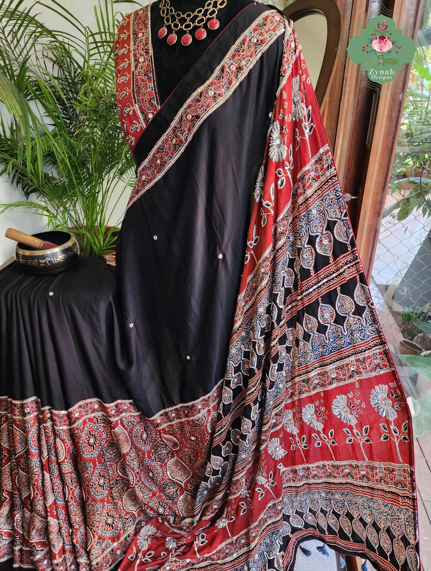 Zynah Siahra – Madder Red & Black Pure Modal Silk Ajrakh Saree with Ajrakh Hand Block Printing & Artisan Embellishments