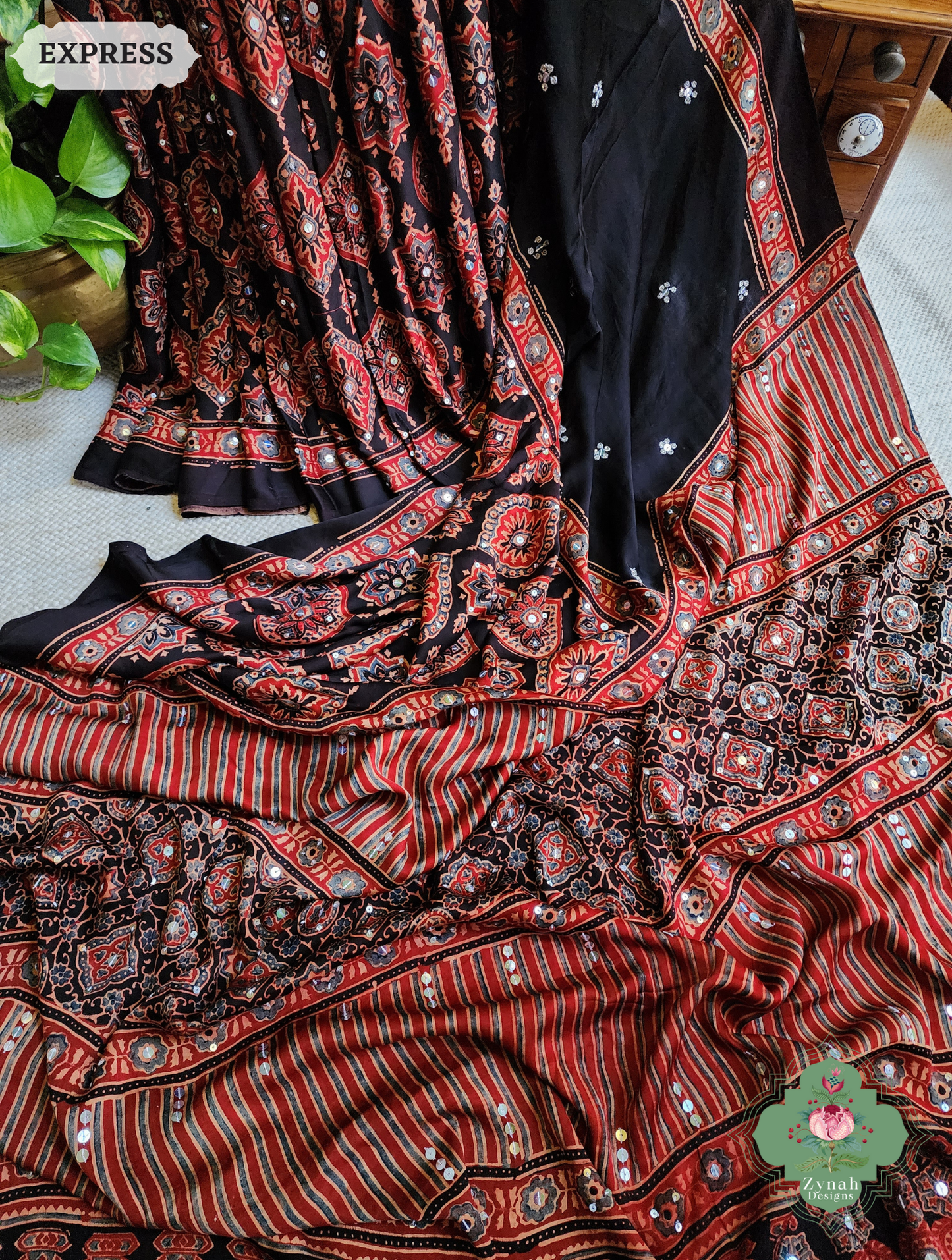 Zynah Madder Red & Black Ajrakh Modal Silk Saree With Sequins Highlight Crafted Using The Traditional Method Of Hand Block Printing Using 100% Natural Dyes; Custom Stitched/Ready-made Blouse, Fall, Petticoat; SKU: 1402202506
