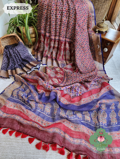 Maroon Linen Saree w/ Ajrakh Print: ethnic charm meets contemporary style. High-quality linen, intricate print in maroon,